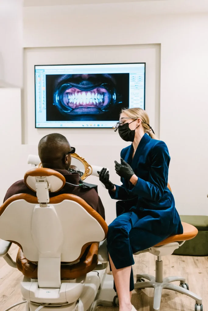 Patient and dentist reviewing a digital scan of his teeth at Vigée Dental